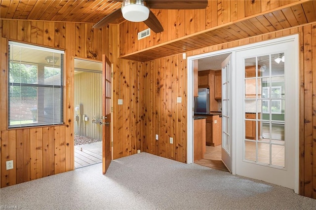 211 Chadbourne Dr, Winston-Salem, NC 27104 - carpeted spare room with wooden walls, ceiling fan, and wooden ceiling