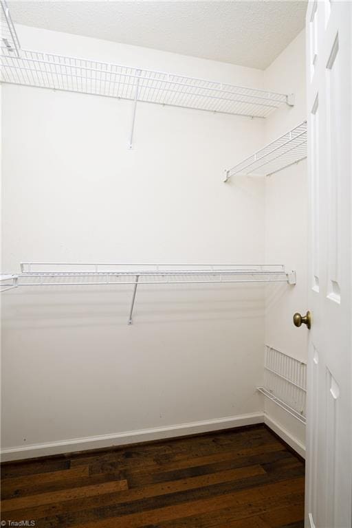 211 Chadbourne Dr, Winston-Salem, NC 27104 - walk in closet featuring dark wood-style floors