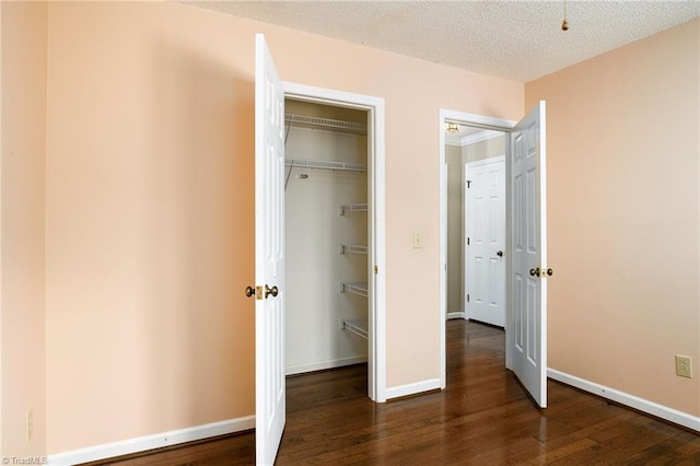 211 Chadbourne Dr, Winston-Salem, NC 27104 - unfurnished bedroom featuring wood finished floors, a closet, and a textured ceiling