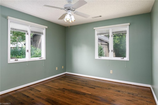 211 Chadbourne Dr, Winston-Salem, NC 27104 - empty room featuring dark wood-style floors, a textured ceiling, and a ceiling fan