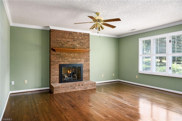 211 Chadbourne Dr, Winston-Salem, NC 27104 - unfurnished living room with a ceiling fan, wood finished floors, a textured ceiling, a fireplace, and ornamental molding