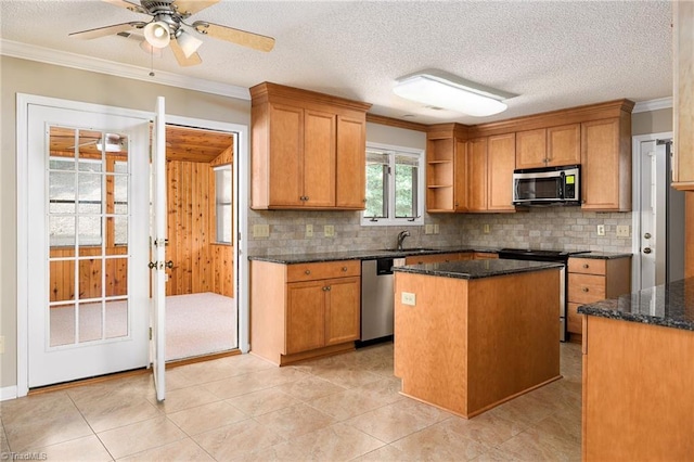 211 Chadbourne Dr, Winston-Salem, NC 27104 - kitchen with stainless steel appliances, tasteful backsplash, crown molding, open shelves, and dark stone countertops