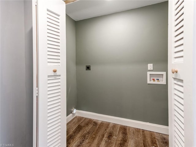 laundry room featuring dark wood-type flooring, hookup for a washing machine, and electric dryer hookup