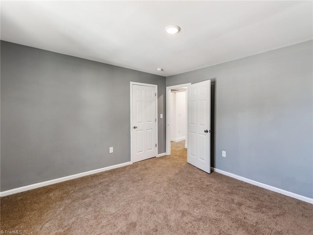 unfurnished room with carpet flooring