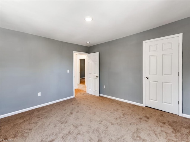 unfurnished bedroom with carpet flooring