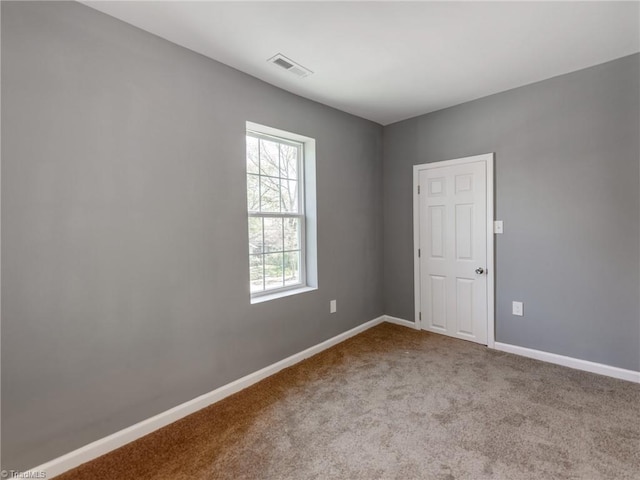 view of carpeted spare room