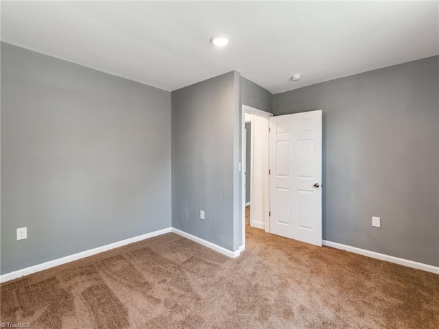 spare room featuring carpet flooring