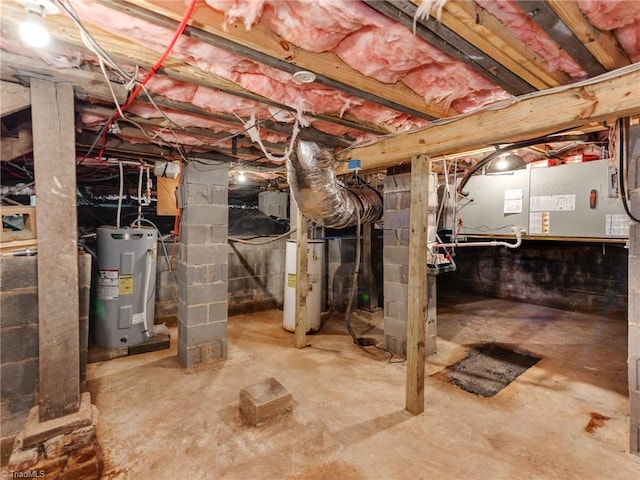 basement with gas water heater and electric water heater