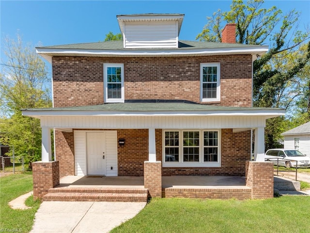 view of front property featuring covered porch