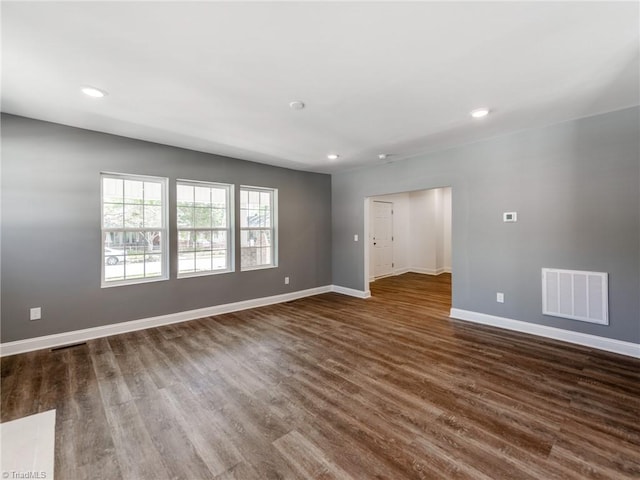 unfurnished room featuring dark hardwood / wood-style floors