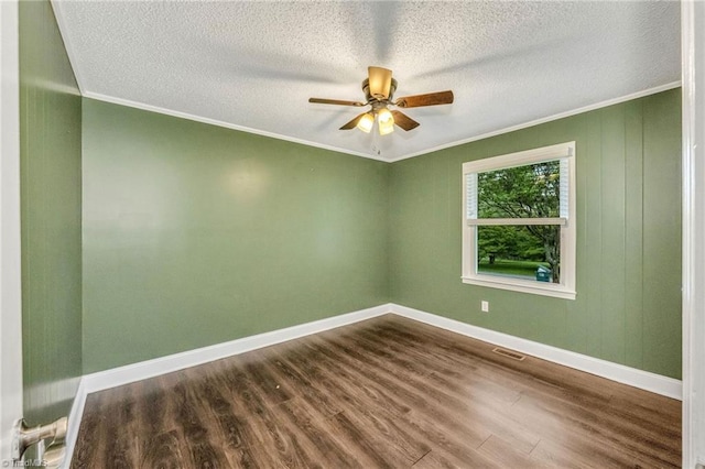 225 E Greencrest Dr, Millers Creek, NC 28651 - unfurnished room with ornamental molding, dark wood-style flooring, a ceiling fan, baseboards, and a textured ceiling