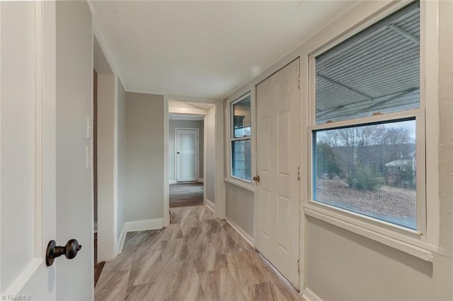corridor featuring baseboards