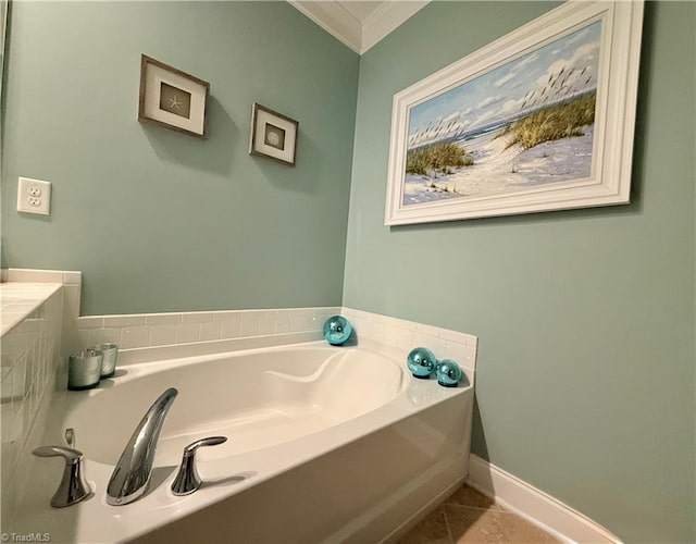 full bath with tile patterned flooring, baseboards, a garden tub, and ornamental molding