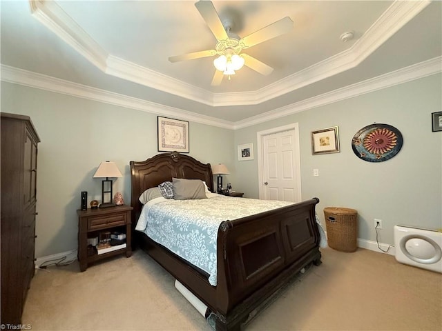 bedroom featuring baseboards, ceiling fan, light colored carpet, ornamental molding, and a raised ceiling