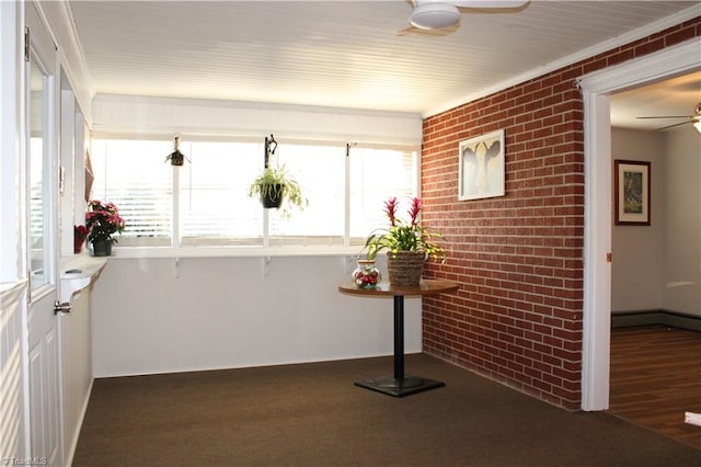 sunroom / solarium with ceiling fan