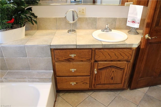 bathroom featuring tile patterned flooring and vanity