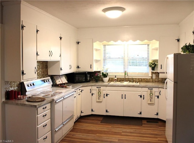 kitchen with sink, dark wood-type flooring, tasteful backsplash, white appliances, and white cabinets