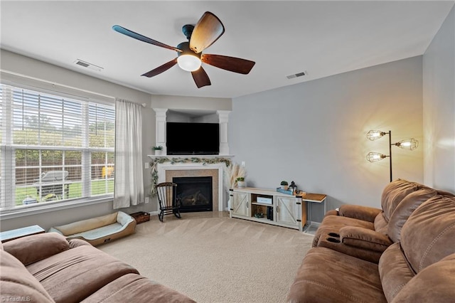 183 Kentland Ridge Dr, Kernersville, NC 27284 - carpeted living room with ceiling fan, a fireplace with flush hearth, decorative columns, and baseboards