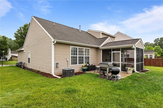 183 Kentland Ridge Dr, Kernersville, NC 27284 - rear view of property featuring a sunroom, a patio area, roof with shingles, and central air condition unit