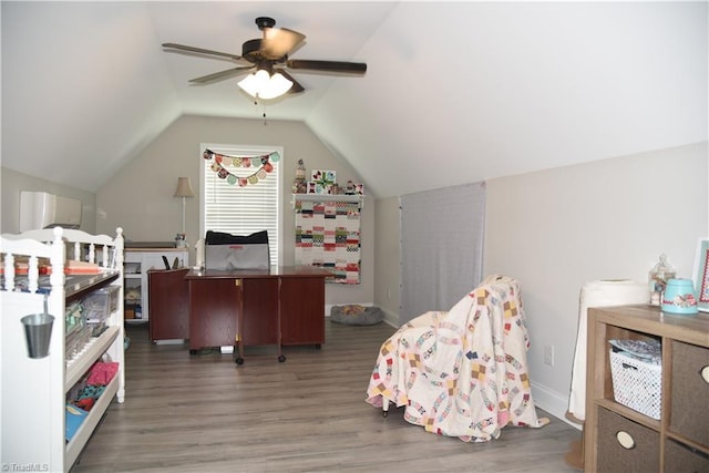 bedroom with ceiling fan, baseboards, lofted ceiling, and wood finished floors