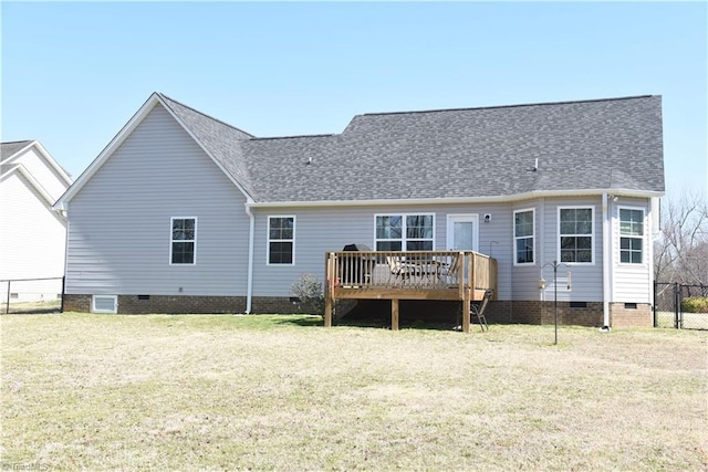 rear view of house featuring a deck, a yard, fence, and crawl space