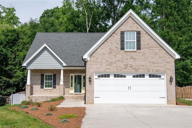 5360 Graycliff Ln, Clemmons, NC 27012 - view of front of property featuring brick siding, driveway, a garage, and a shingled roof