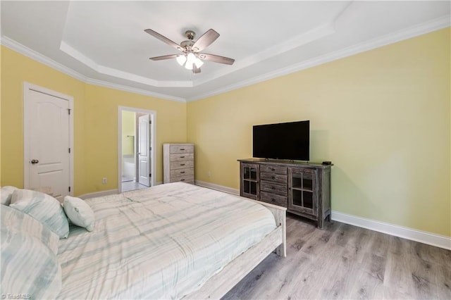 5360 Graycliff Ln, Clemmons, NC 27012 - bedroom with a raised ceiling, wood finished floors, ornamental molding, a ceiling fan, and ensuite bath