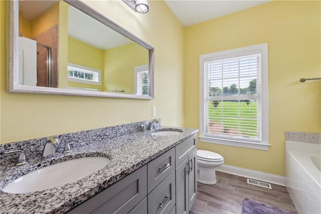 5360 Graycliff Ln, Clemmons, NC 27012 - full bath with plenty of natural light, double vanity, a garden tub, and an enclosed shower