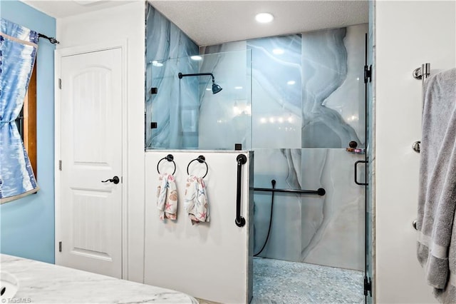 full bath featuring recessed lighting and a marble finish shower