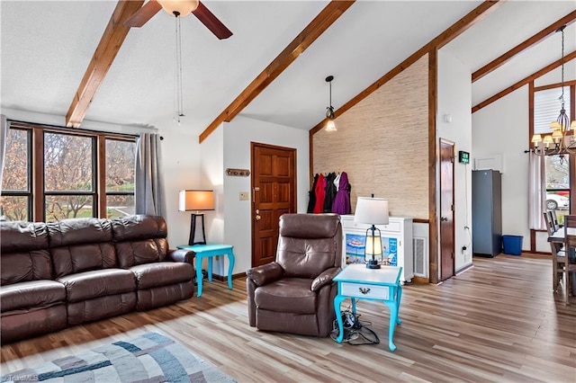 living room featuring beam ceiling, ceiling fan with notable chandelier, high vaulted ceiling, and wood finished floors