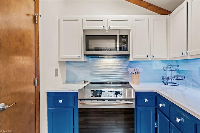 kitchen with light stone counters, decorative backsplash, white cabinets, stainless steel appliances, and blue cabinets