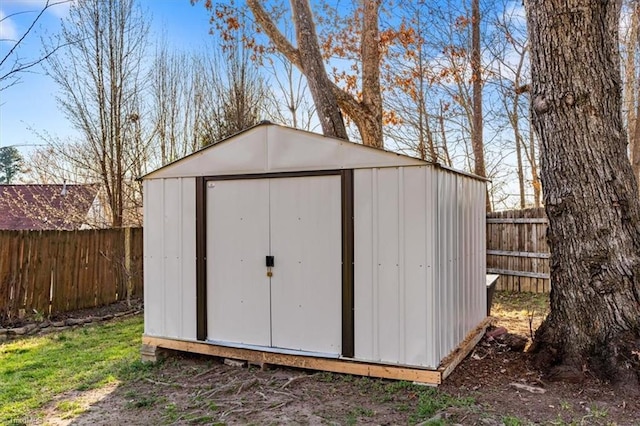 view of shed featuring a fenced backyard