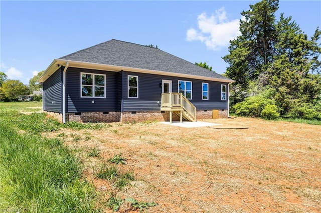 back of property with crawl space and a patio area