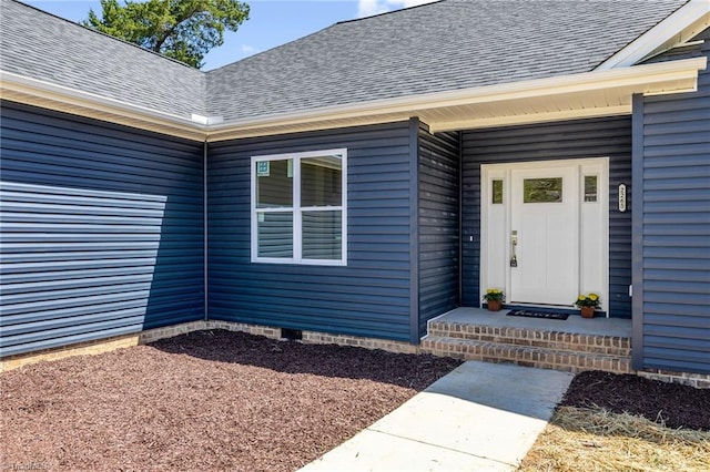 doorway to property featuring crawl space and a shingled roof