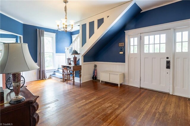 entryway featuring a wealth of natural light, wood-type flooring, and a chandelier