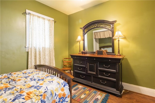 bedroom featuring dark hardwood / wood-style flooring