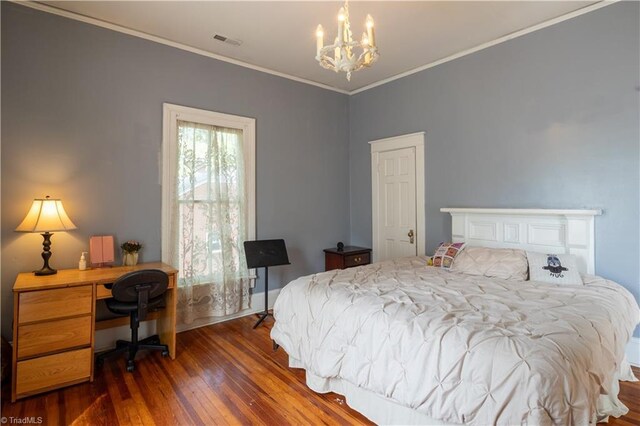 bedroom with ornamental molding, an inviting chandelier, and dark wood-type flooring