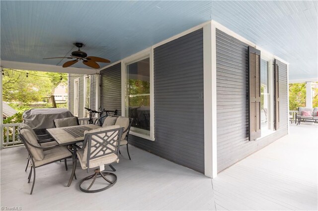 view of patio featuring ceiling fan