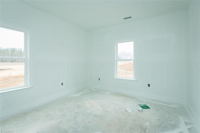 spare room featuring a wealth of natural light