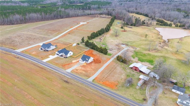 birds eye view of property with a rural view