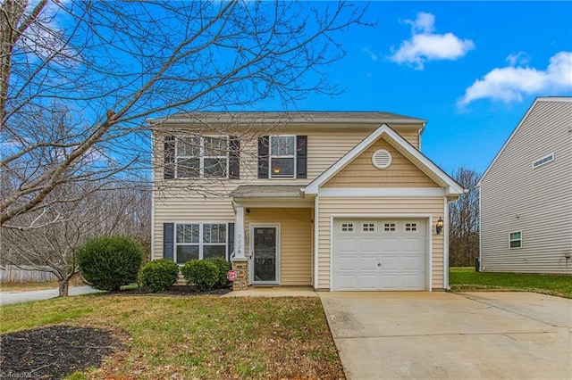 view of front of property with a garage and a front lawn