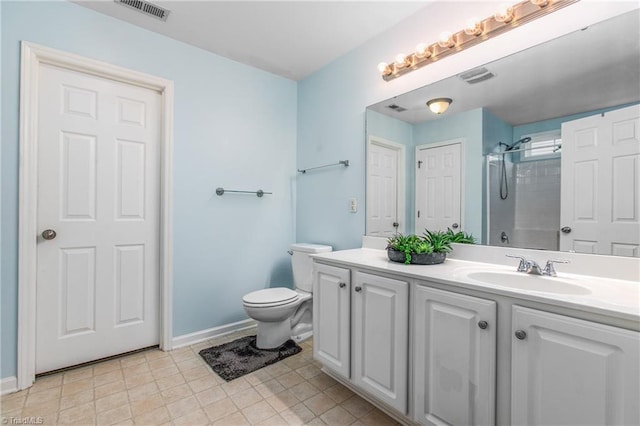 bathroom with vanity, toilet, and a shower with door