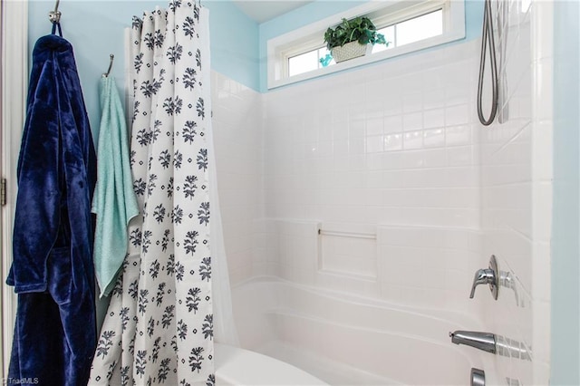 bathroom with shower / bathtub combination with curtain