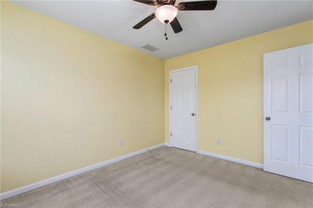 unfurnished bedroom with ceiling fan and light carpet