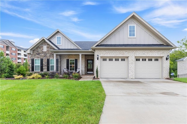 craftsman house featuring a garage and a front lawn