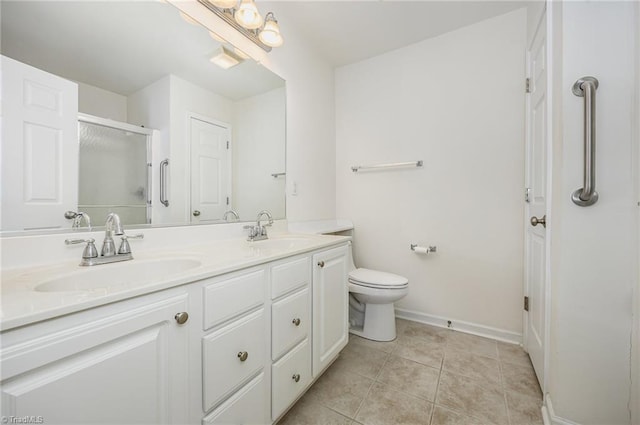 full bathroom featuring a sink, tile patterned floors, a stall shower, and double vanity