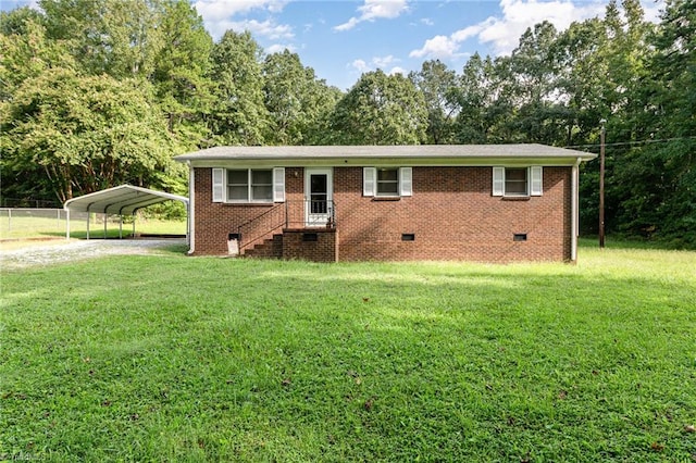 view of front facade with a front lawn and a carport