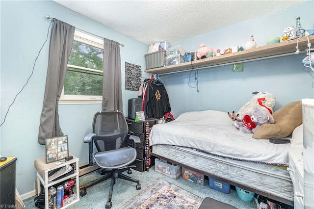 carpeted bedroom featuring a textured ceiling