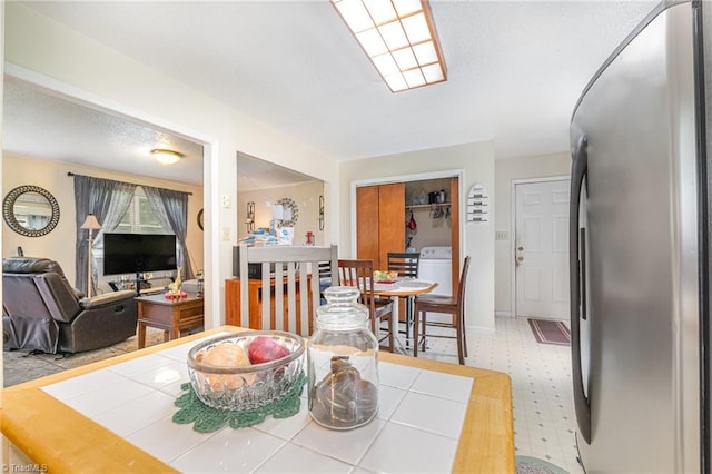 dining space with washer / clothes dryer