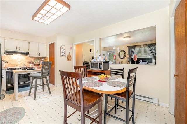 dining room featuring baseboard heating